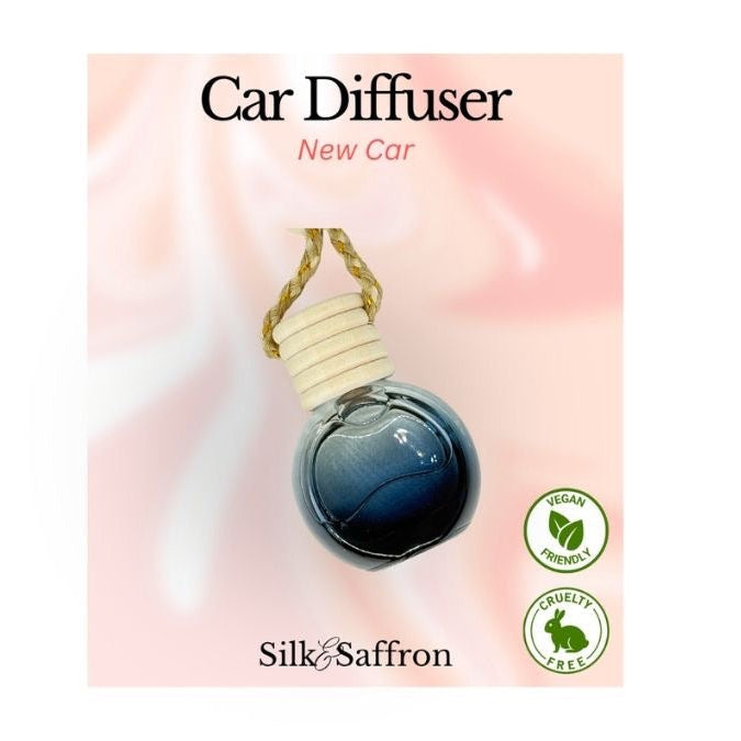 Car diffuser packaging with 'New Car' fragrance by Silk & Saffron on a pink background.